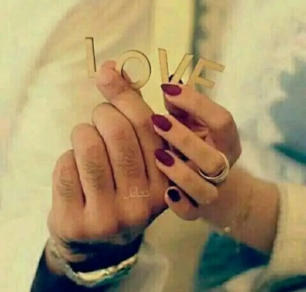 beautiful hands with rings and nail polish with love 